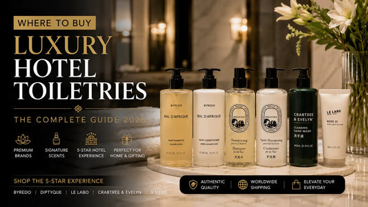 Luxury hotel toiletries from Byredo, Diptyque, Le Labo, and Crabtree & Evelyn displayed in a premium hotel bathroom