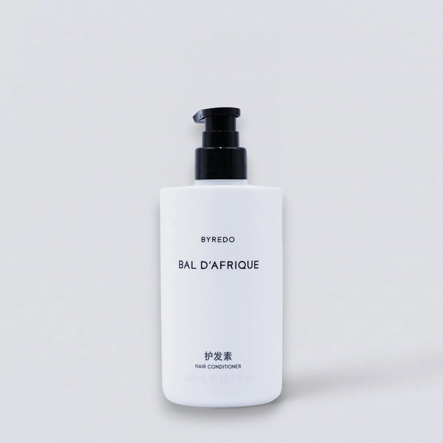 BYREDO Bal d'Afrique Conditioner 450ml, as featured in InterContinental luxury guest rooms. Deeply nourishing hair repair with iconic floral notes by Luxe Hotel Essentials.