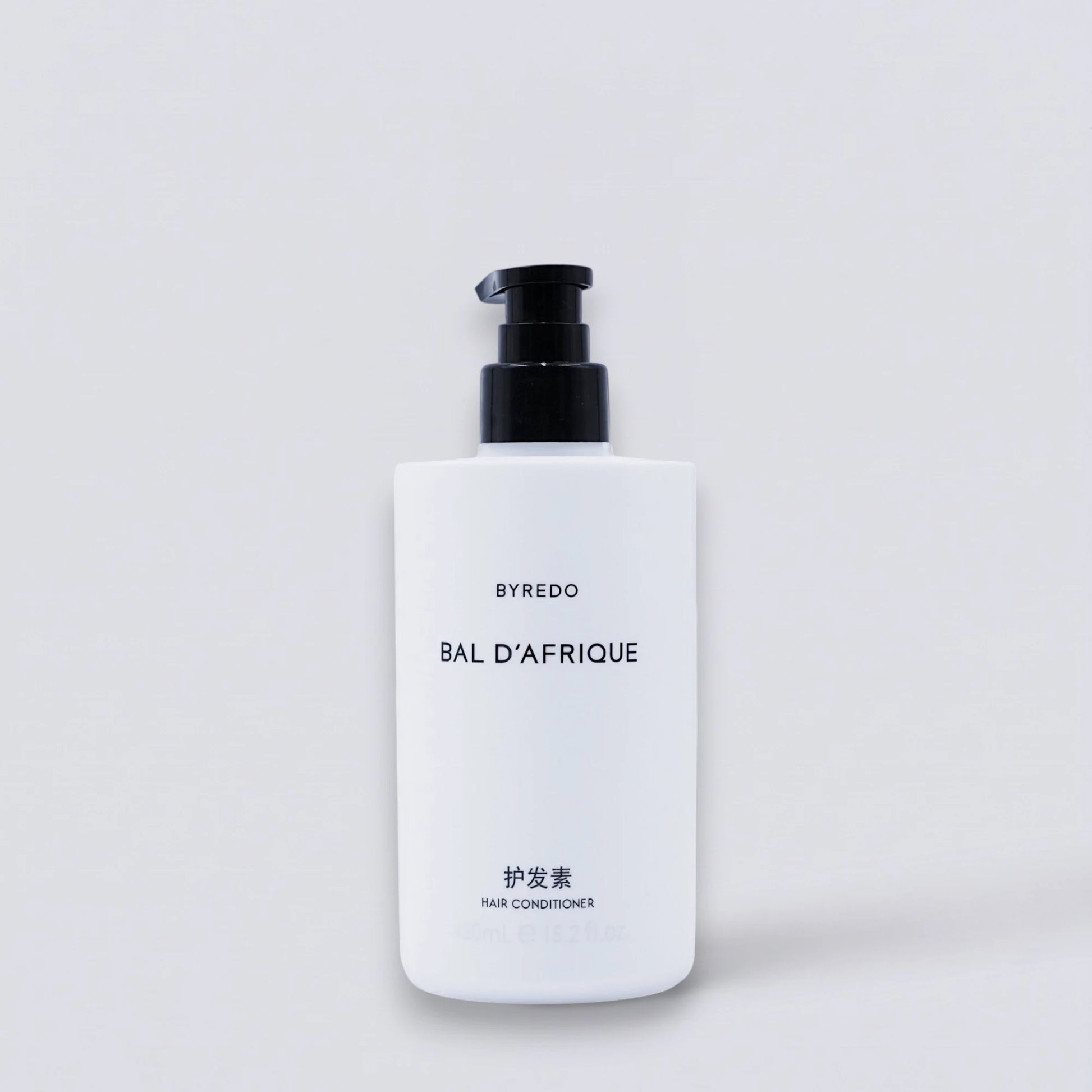 BYREDO Bal d'Afrique Conditioner 450ml, as featured in InterContinental luxury guest rooms. Deeply nourishing hair repair with iconic floral notes by Luxe Hotel Essentials.