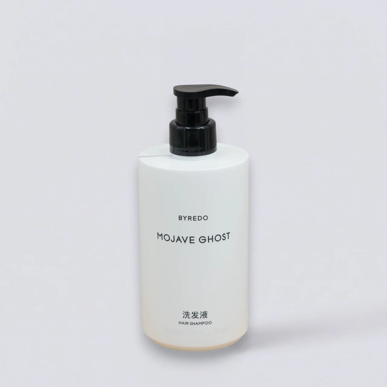 BYREDO Mojave Ghost Shampoo 450ml, as featured in Courtyard by Marriott hotels. Ethereal woody hair care by Luxe Hotel Essentials.