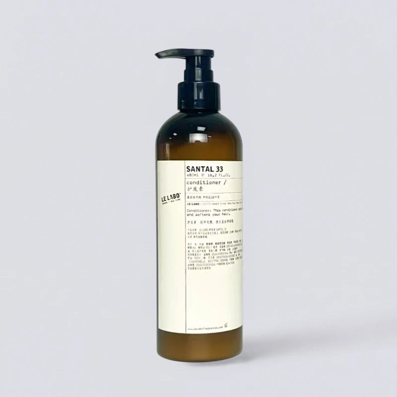 Le Labo Santal 33 Conditioner 480ml, premium hair repair with the cult-classic EDITION fragrance. Nourishing botanical formula by Luxe Hotel Essentials.