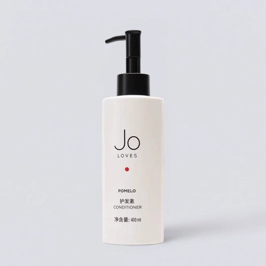Jo Loves Pomelo & Cedarwood Conditioner 400ml, premium hair repair with Jo Malone MBE's signature scent. Nourishing citrus formula by Luxe Hotel Essentials.