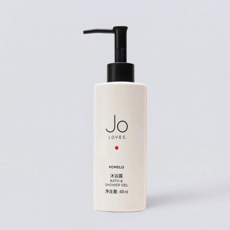 Jo Loves Pomelo & Cedarwood Shower Gel 400ml, as featured in premium luxury hotels. Refreshing grapefruit and cedar body wash by Luxe Hotel Essentials.