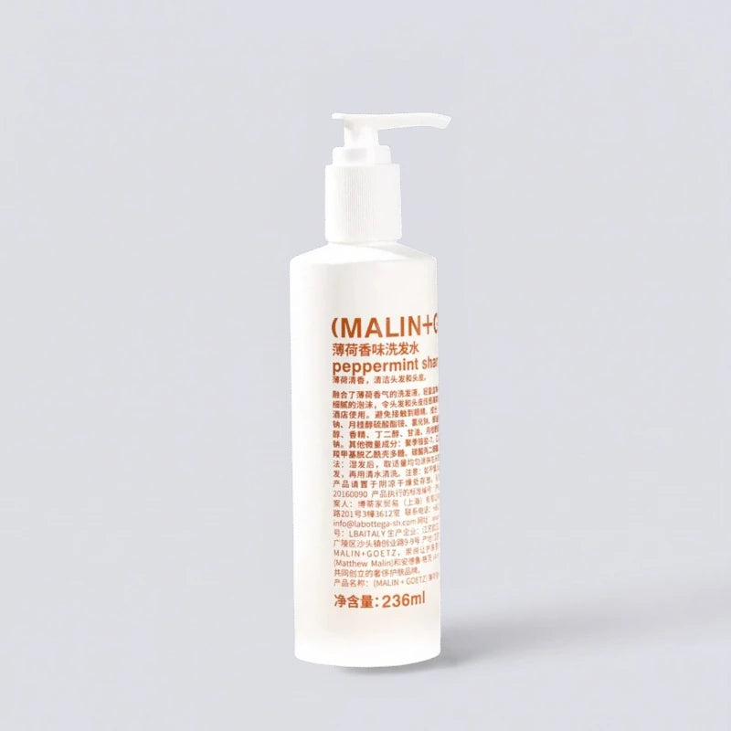 (MALIN+GOETZ) Peppermint Shampoo 236ml, the refreshing signature scent of Le Méridien Hotels. Natural peppermint hair care by Luxe Hotel Essentials.