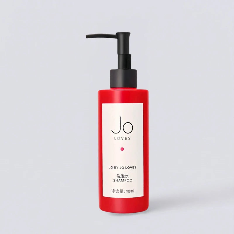 Jo Loves Red Edition Shampoo 400ml, inspired by the luxury amenities of Marriott Hotels. Vibrant citrus hair care by Luxe Hotel Essentials.